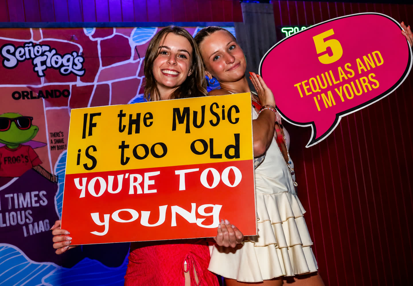 Guests with a party sign at Señor Frog’s Cancun